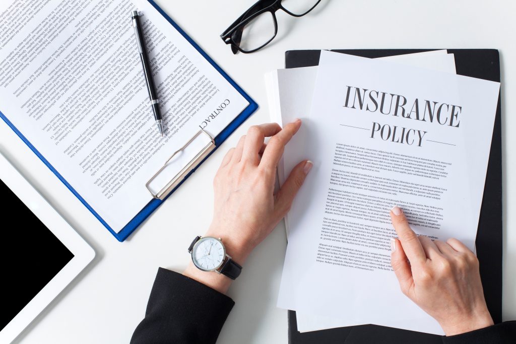 Business woman showing insurance document